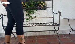 Roxan lets her high heels dangle from her feet softly (3)