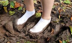 Muddy white ankle socks, dirty white socks, wet white socks, ankle socks dirty, ankle socks in mud, socks posing