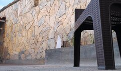 With her legs crossed beautiful mistress lets her stiletto heels hang down (1)