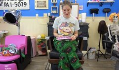 Getting dressed into fishnet body stockings and silver vest, skirt, and ankle boots