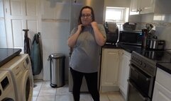 stripping in leggings and bra in the kitchen