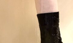Close up of my black leather boots getting wet in the shower