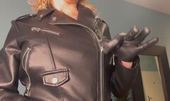 Sexy blonde plays with her zipper on the leather jacket