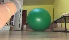 Val jumping on big green yogaball