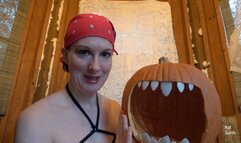 Woman dressing up as a topless domme witch