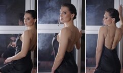 Evening relaxing cigarette in evening dress