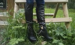 Leathana takes boots and cuffs on an adventure, with a chain