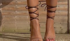 Walking and posing in sexy black tie up heels