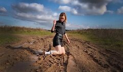 Muddy knee high white socks and black stockings, white socks on muddy field, wet white sock