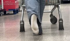 Naughty Amelie gets her white socks dirty walking around the grocery store having forgot to wear shoes