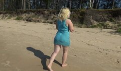 Milf teases pussy on the beach