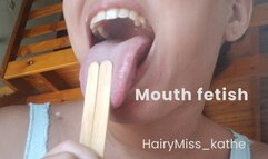 Full lips, playing with a lollipop