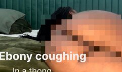 Ebony coughing in a thong