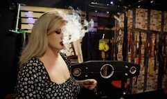 Turning the sissy into an ashtray!