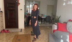 A girl in high-heeled shoes crushes fruits and vegetables