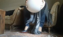 A BIG STURDY BALLOON UNDER MY POWERFUL HEELS