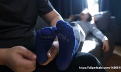 Woman with smelly socks and smelly feet is tickled