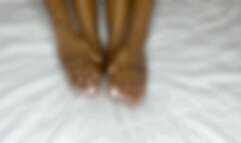 Big foot trying on toe rings