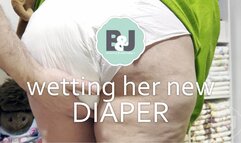 Wetting her new diaper