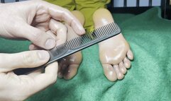 Tickling girlfriend's feet in bed face down with a comb and oil