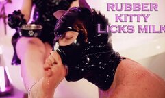 Rubber kitty in chastity licks milk from Mistress feet