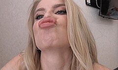 A blondie with a gorgeous make-up sniffs her lips! MP4