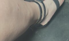 Driving in black strappy wedge sandles with black nail polish