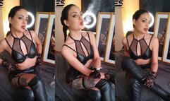 Smoking in leather and fishnet stockings