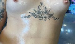 Nacked girl on big cristall balloon blowing and pop big red balloon