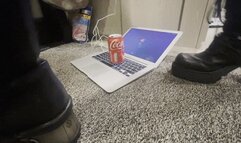 Cans crushed with New rock boots on mac book