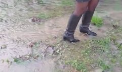 High heeled leather boots in puddles and water
