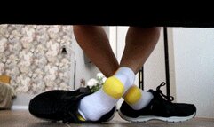 White socks with a yellow heel play with men shoes WMV