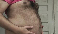 The big bear showing and playing with his huge belly