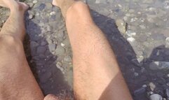 Public sunbathing naked in the river with a flaccid dick (avi)