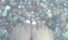 Ebony feet flirt with heated rocks Ebony milf goddess giantess