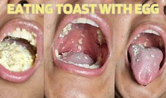 Eating toast with scrambled eggs