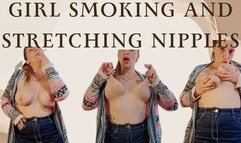 Girl smoking and stretching nipples up