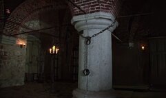 Romina, accused of witchcraft, is chained to a pillar and whipped to learn humility