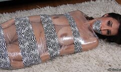 Slender But Busty Little Sophia Taylor Is Wrapped In Plastic That's Overlaid With Stylish Zebra-Pattern Tape!