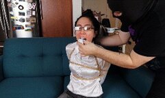 Khrystal in shiny white blouse gagged with stuffed mouth and tape gagged with clear tape and then with wraparound, her toes tightly tied with zip ties