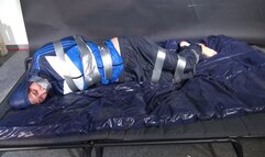 Myxxxy bound and gagged in shiny nylon blue Rainwear trying to free herself