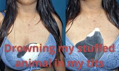 Squashing the stuffed with my tits