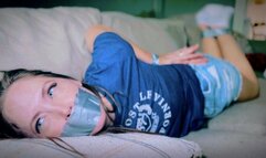 Captured In Her Ankle Socks, The Intruder Wasted No Time Taping Up Rachel Adams (4K) - Rachel Adams - puma socks, denim skirt, t-shirt, duct tape, hand over mouth, tape gag, tied on sofa