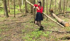 Woman smokes in the forest and undresses on camera