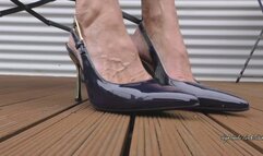 Toe and Heel Tapping with elegant blue pointy High Heel Slingbacks Outdoors