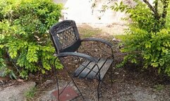 Beautiful lady in fishnet stockings and high heels sits and crosses her legs to smoke cigarette (3)