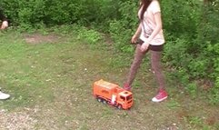 two girls crush a car