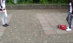 two girls crushing a car