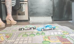 MissaRaeBerry toy car crush she crushes 2 old race cars in Chucky wedges close ground view