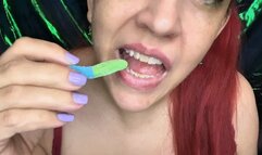 Biting and Chewing Neon Sour Gummy Worms 6 13 25